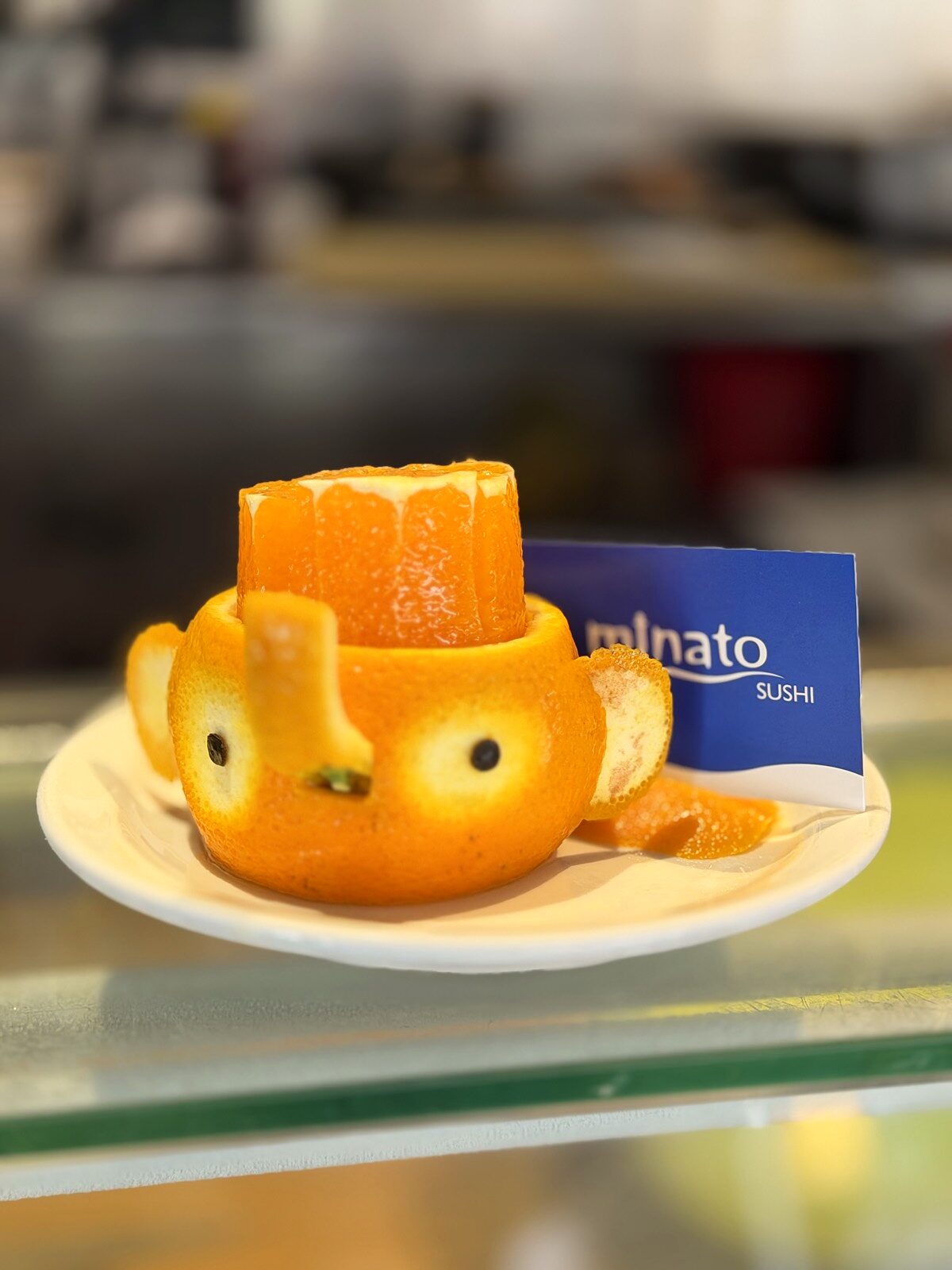 Hand-carved orange elephant at Minato Sushi