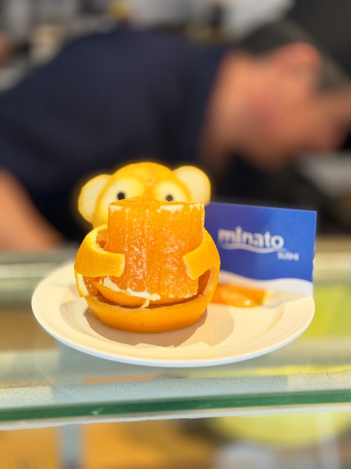 Hand-carved orange monkey at Minato Sushi